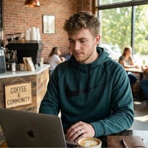 Nike Men's Therma-FIT Pullover Hoodie in a dark forest green
